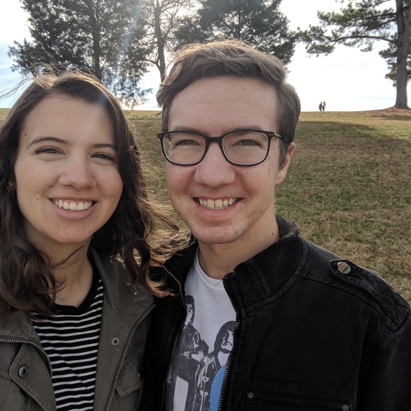 Summer and her partner say cheese in nature. 